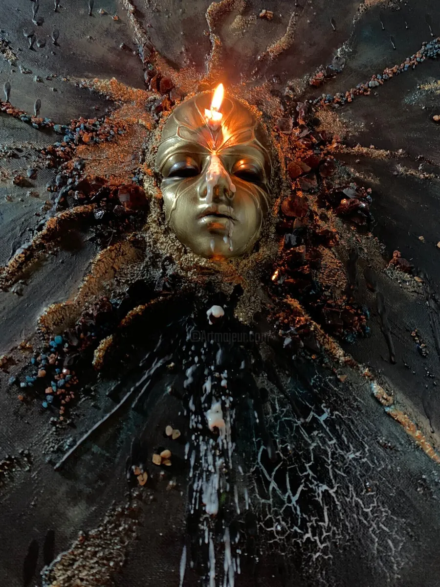 One Sin with a candle burning on the golden mask
